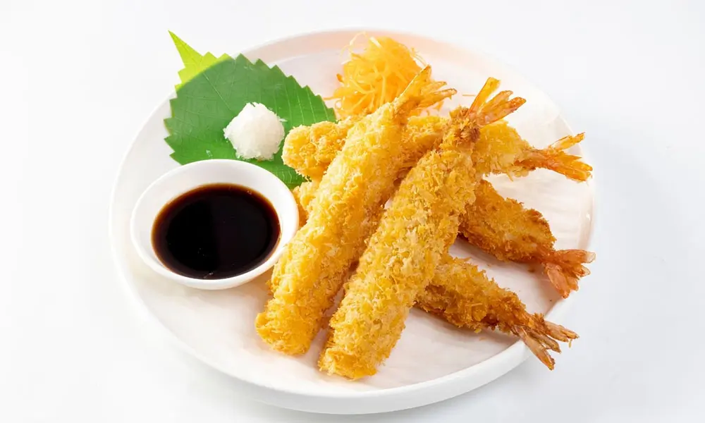Lightly battered and fried shrimp served with dipping sauce at Zen Japanese Cuisine, a Japanese Restaurant in Schertz